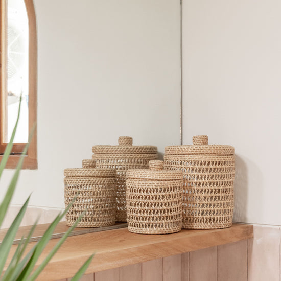 Woven Rattan Basket Set with Lids PREORDER handmade by Village Thrive using natural materials.