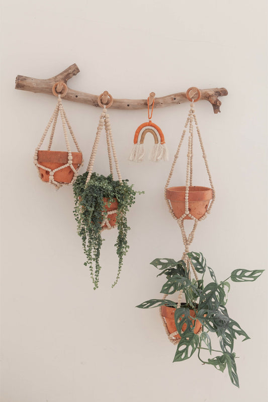 Wood Beaded Plant Hangers handmade by Village Thrive using natural materials.