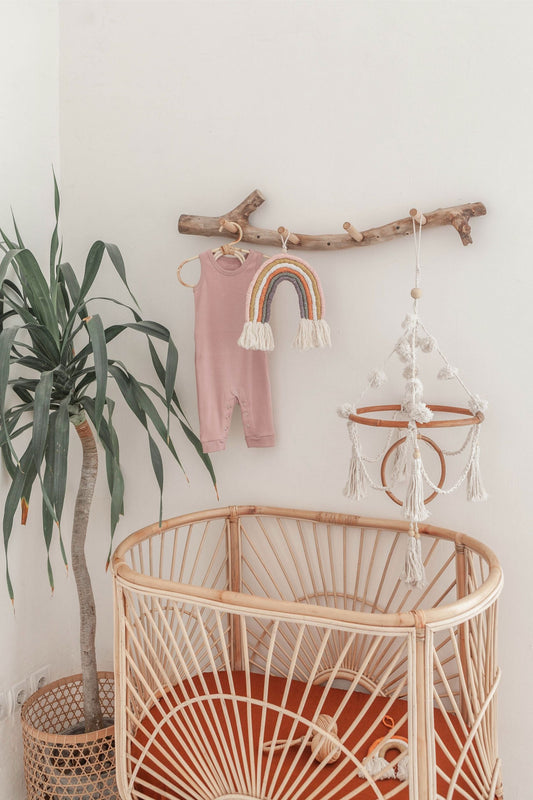 Imperfect Pom Pom Baby Mobile handmade by Village Thrive using natural materials.