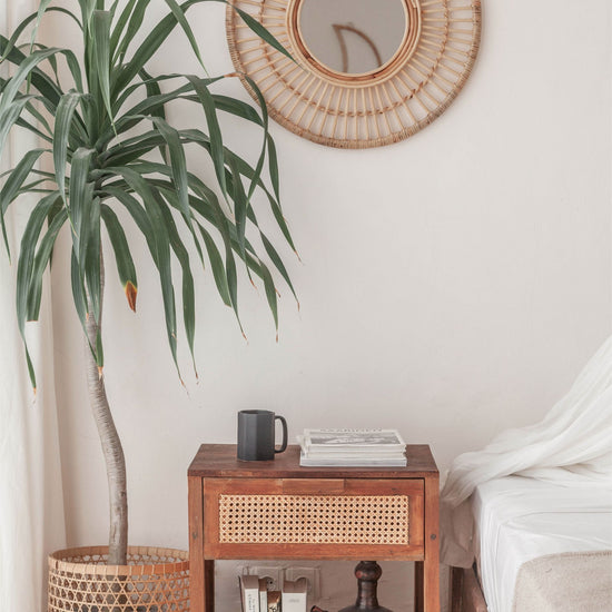 Eliana Rattan Mirror handmade by Village Thrive using natural materials.