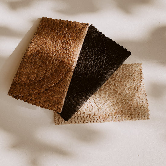 Imperfect Rattan Clutch handmade by Village Thrive using natural materials.
