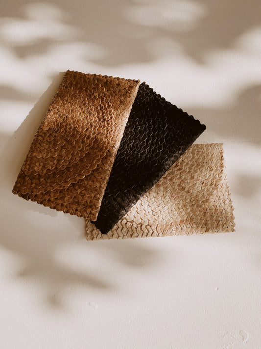Imperfect Rattan Clutch handmade by Village Thrive using natural materials.
