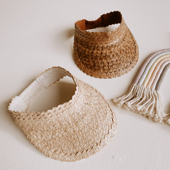 Rattan Sun Visors for Kids handmade by Village Thrive using natural materials.