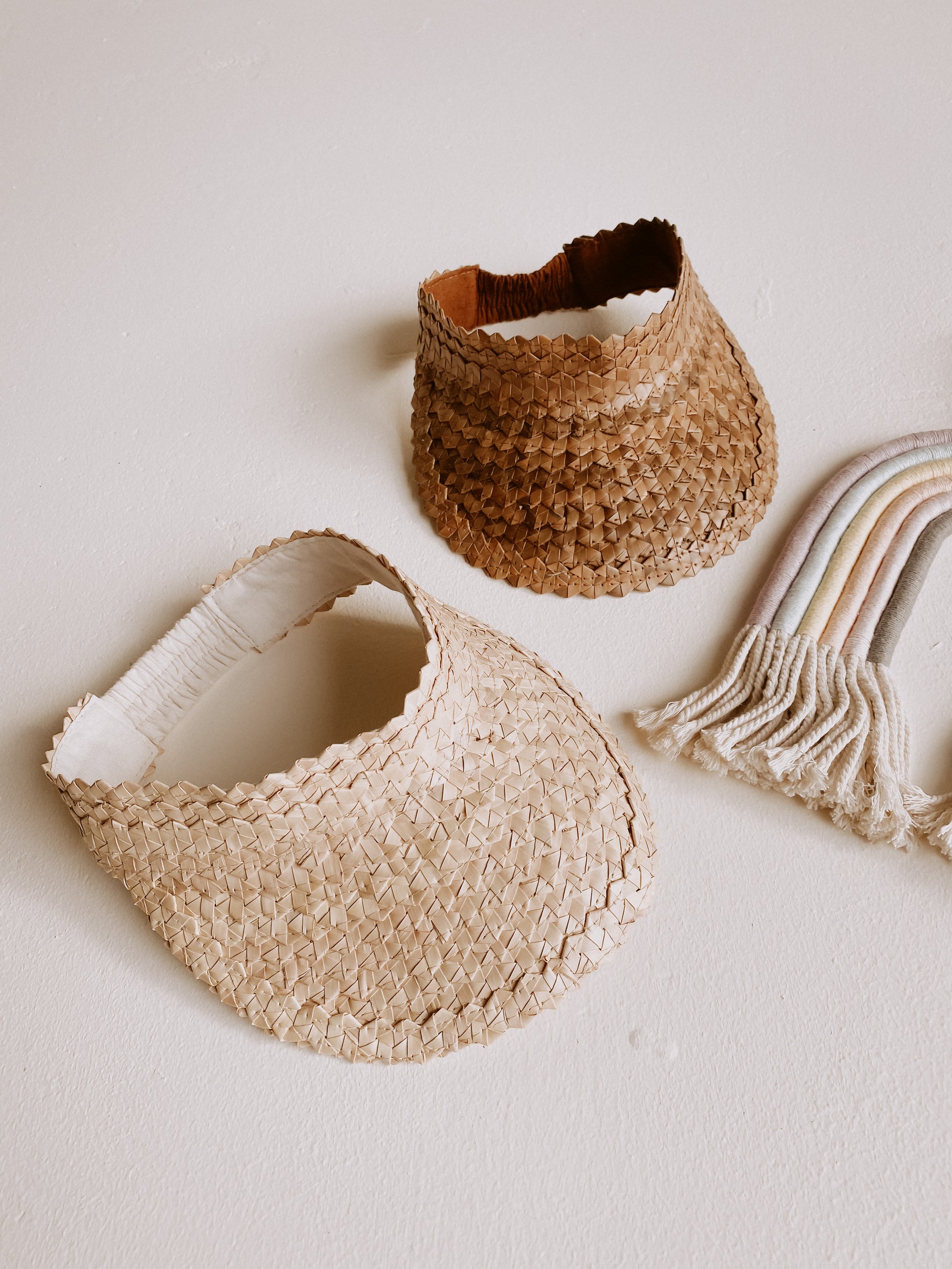 Rattan Sun Visors for Kids handmade by Village Thrive using natural materials.