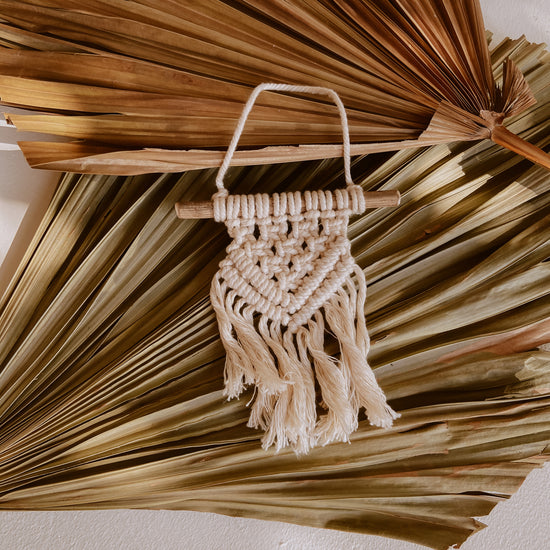 Ivy Small Macrame Wall Hanging handmade by Village Thrive using natural materials.