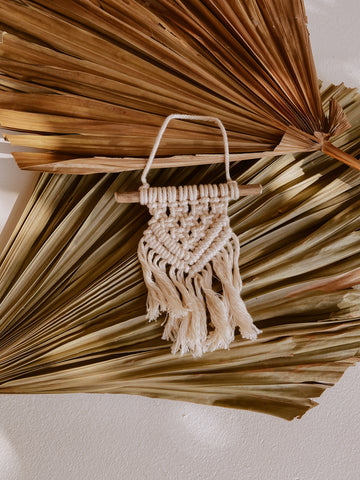 Ivy Small Macrame Wall Hanging handmade by Village Thrive using natural materials.