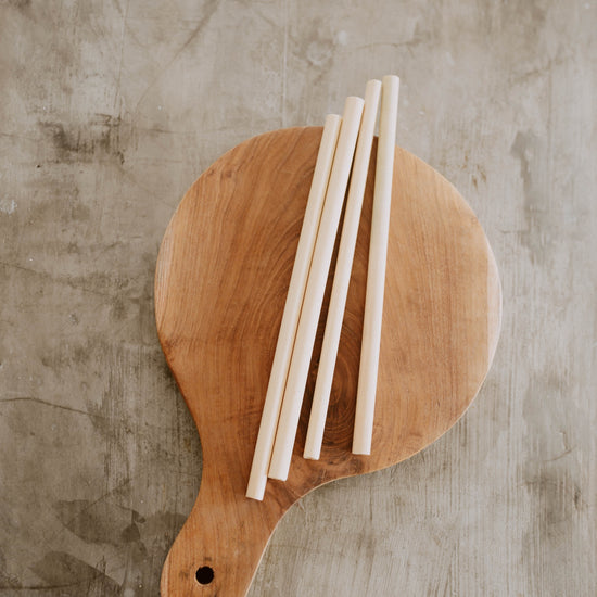 Sustainable Bamboo Straws with Cleaner handmade by Village Thrive using natural materials.