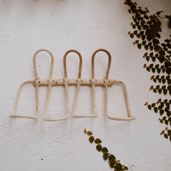 Imperfect Ombak Rattan Wall Hook handmade by Village Thrive using natural materials.