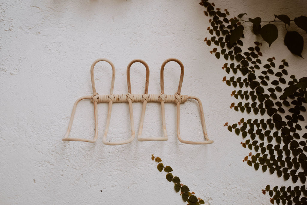 Imperfect Ombak Rattan Wall Hook handmade by Village Thrive using natural materials.