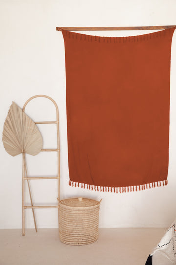 Terracotta Tapestry handmade by Village Thrive using natural materials.