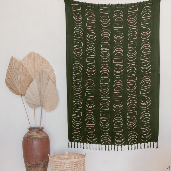 Moon Phase Tapestry handmade by Village Thrive using natural materials.