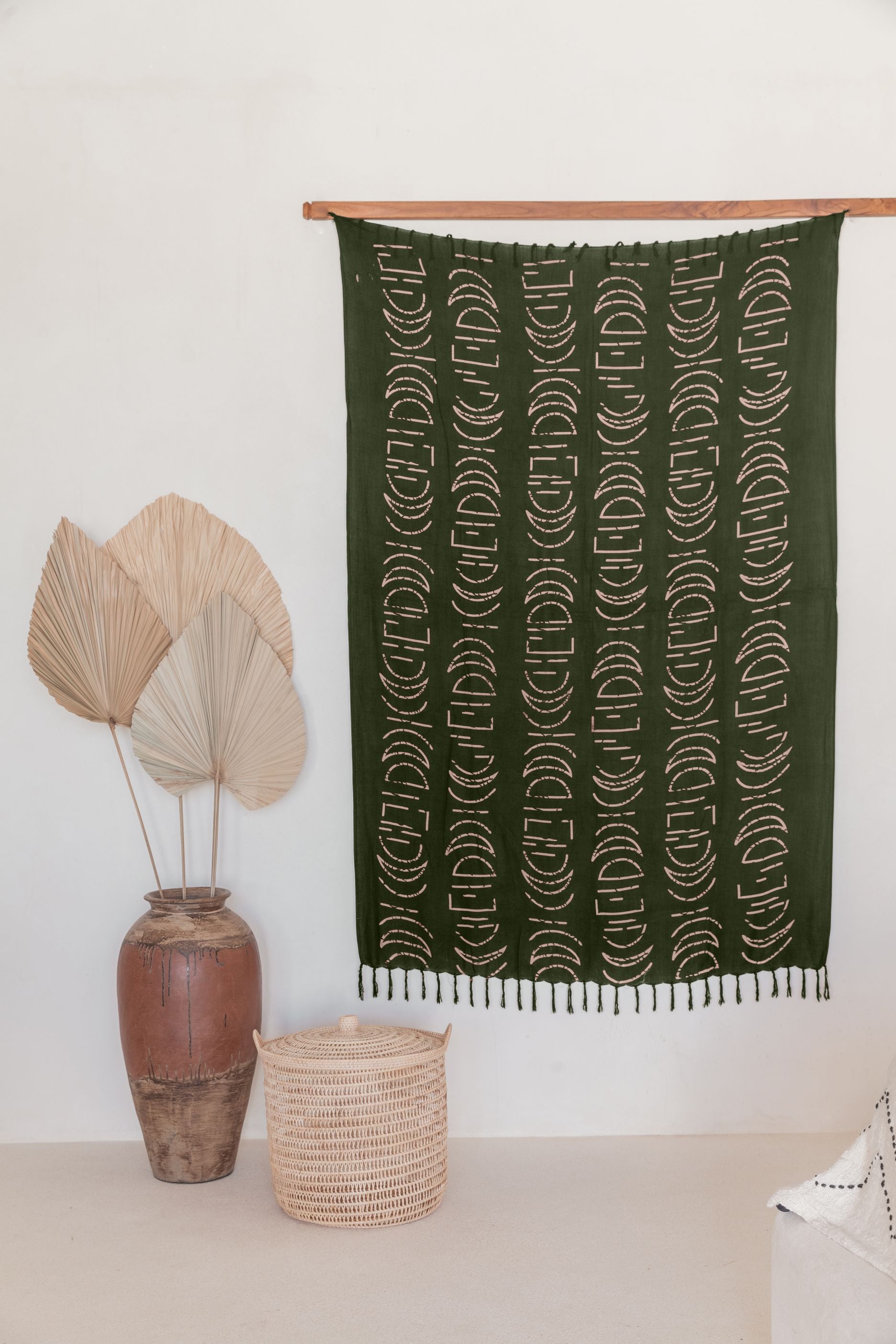 Moon Phase Tapestry handmade by Village Thrive using natural materials.