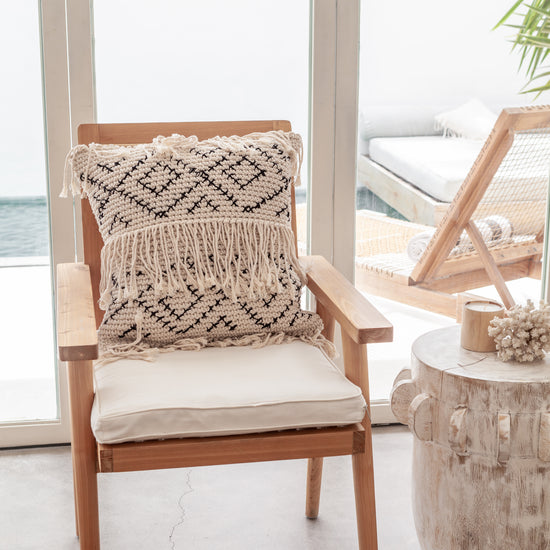 Bohemian Tasseled Macrame Throw Pillow handmade by Village Thrive using natural materials.