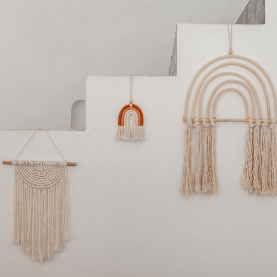 Small Macrame Rainbow handmade by Village Thrive using natural materials.
