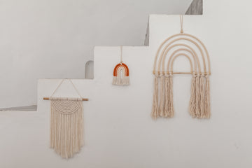 Small Macrame Rainbow handmade by Village Thrive using natural materials.