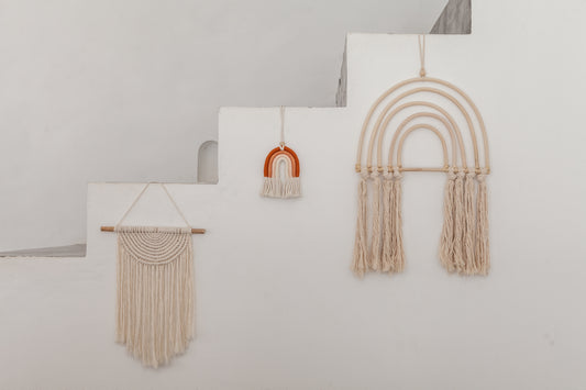 Small Macrame Rainbow handmade by Village Thrive using natural materials.