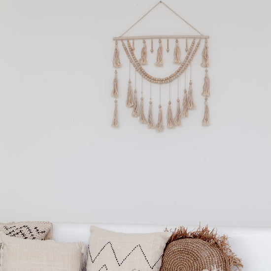 Imperfect Ulu Tassel Wall Hangings handmade by Village Thrive using natural materials.