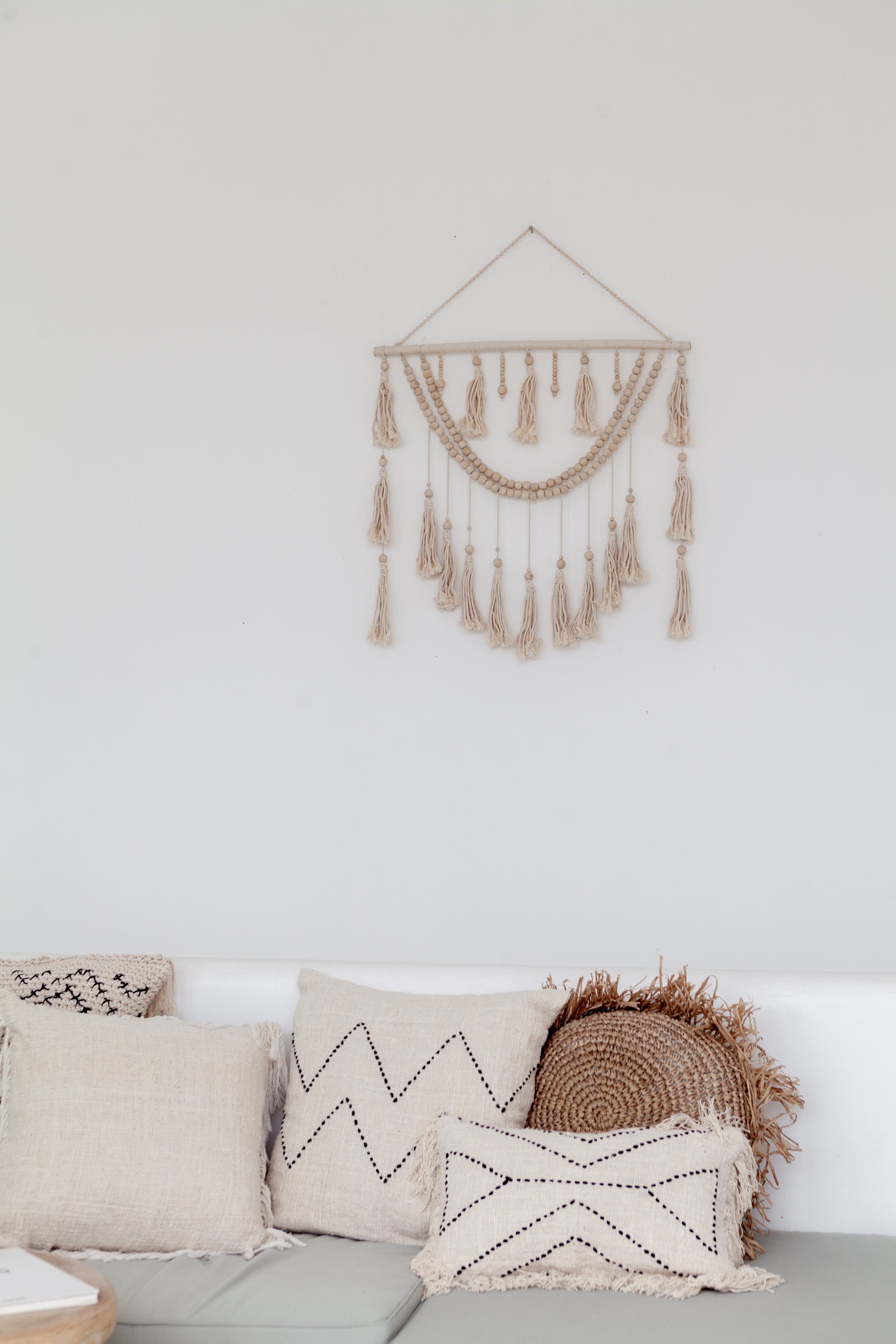 Imperfect Ulu Tassel Wall Hangings handmade by Village Thrive using natural materials.