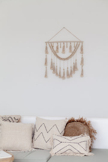 Imperfect Ulu Tassel Wall Hangings handmade by Village Thrive using natural materials.