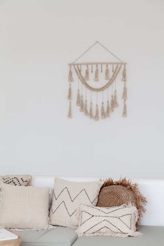 Imperfect Ulu Tassel Wall Hangings handmade by Village Thrive using natural materials.