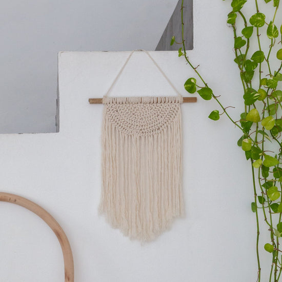 Iris Macrame Wall Hanging handmade by Village Thrive using natural materials.