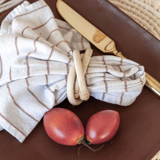 Rattan Napkin Rings handmade by Village Thrive using natural materials.