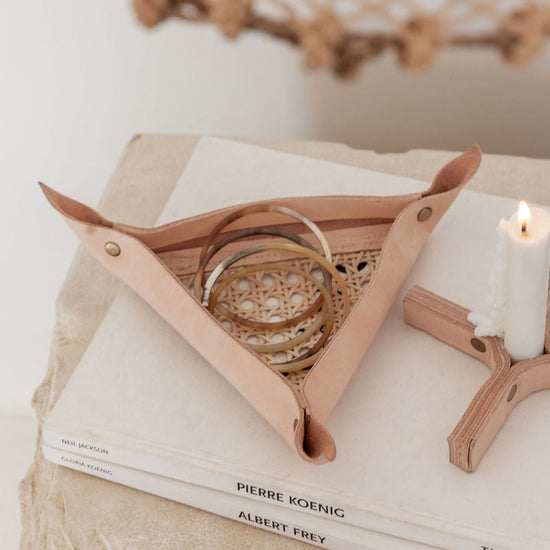 Leather and Cane Webbing Catch-all handmade by Village Thrive using natural materials.