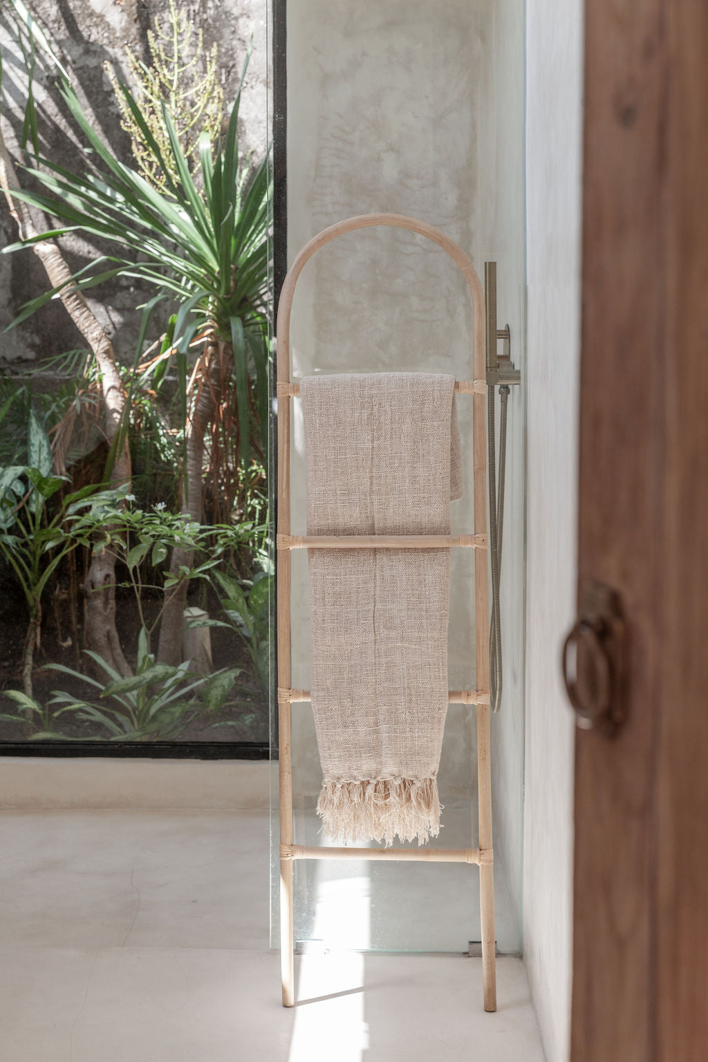 Arch Rattan Ladder handmade by Village Thrive using natural materials.