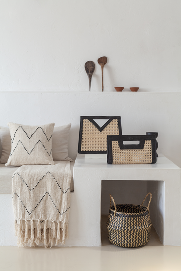 Imperfect Raja Leather and Cane Clutch handmade by Village Thrive using natural materials.