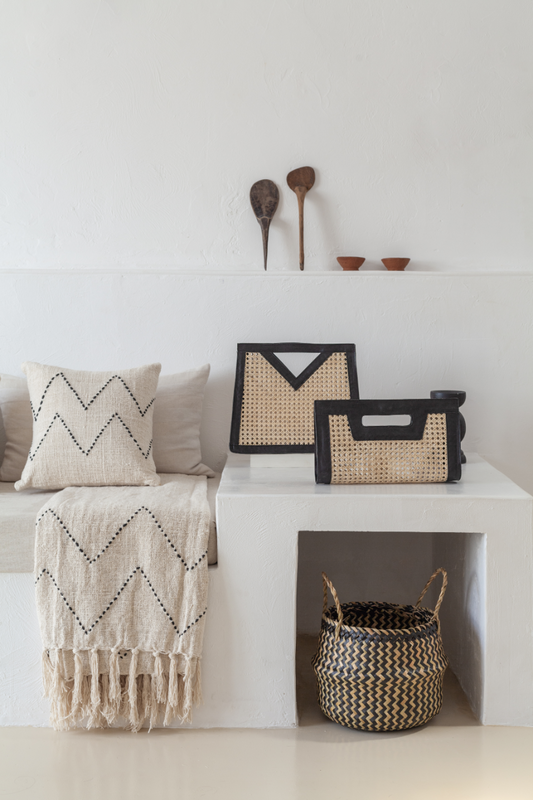 Imperfect Raja Leather and Cane Clutch handmade by Village Thrive using natural materials.