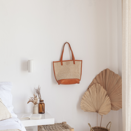 Imperfect Raja Leather and Cane Tote handmade by Village Thrive using natural materials.