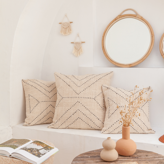 Modern Rattan Mirror handmade by Village Thrive using natural materials.