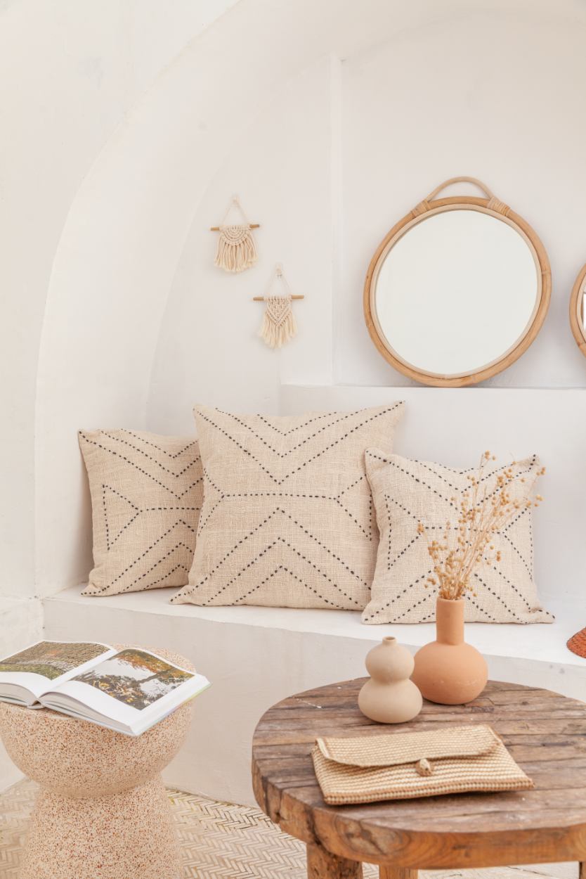 Modern Rattan Mirror handmade by Village Thrive using natural materials.