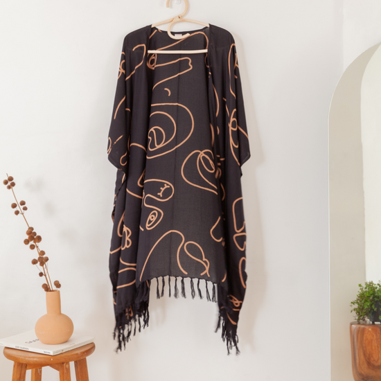 Faces Kimono handmade by Village Thrive using natural materials.