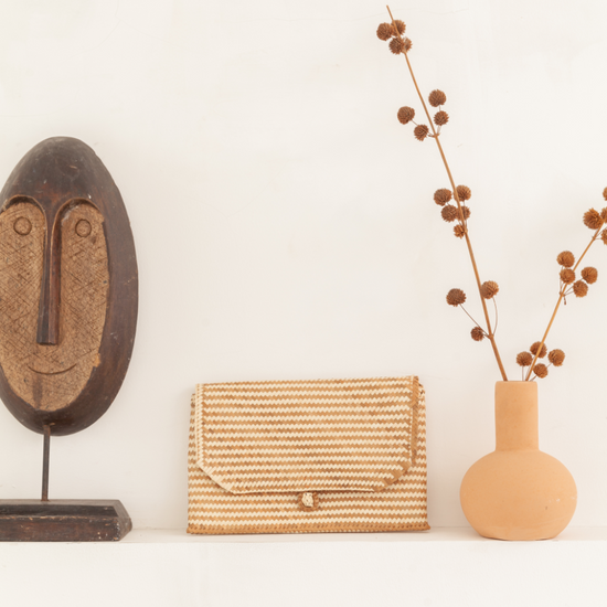 Imperfect Rattan Patterned Clutch handmade by Village Thrive using natural materials.