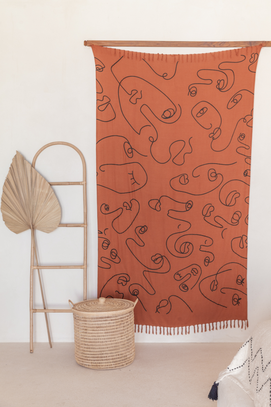 Faces Tapestry handmade by Village Thrive using natural materials.