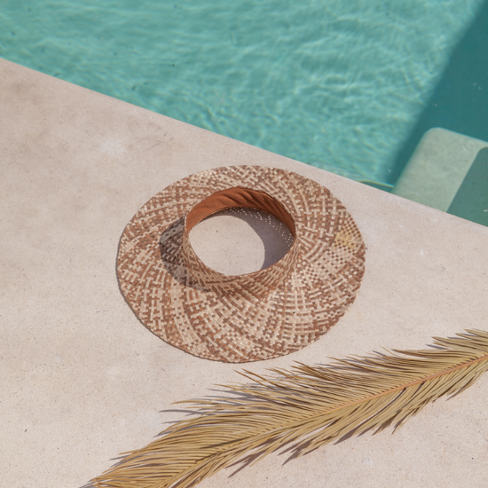 Ombre Holiday Papale Sun Hat handmade by Village Thrive using natural materials.