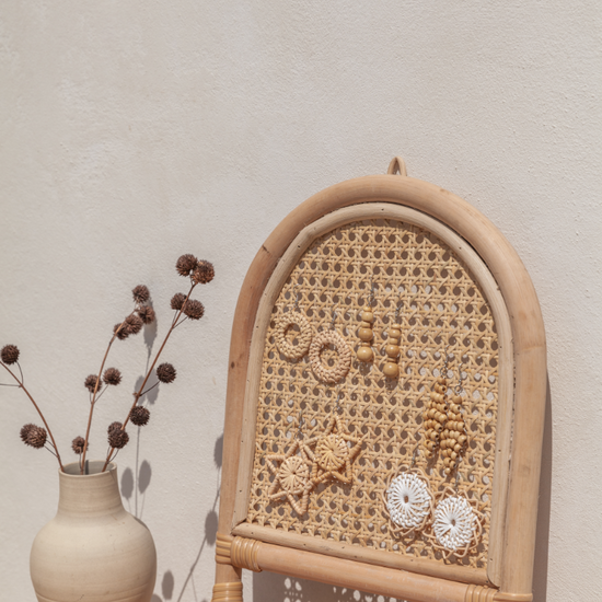 Imperfect Arch Rattan Jewelry Hanger handmade by Village Thrive using natural materials.