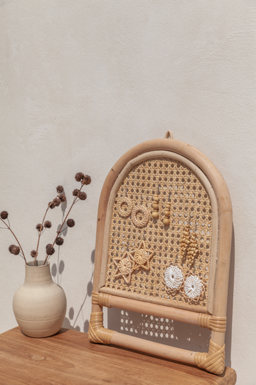 Imperfect Arch Rattan Jewelry Hanger handmade by Village Thrive using natural materials.