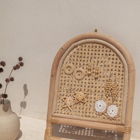 Arch Rattan Jewelry Hanger handmade by Village Thrive using natural materials.
