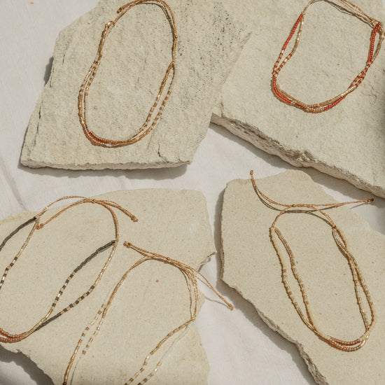 Golden Beaded Bracelet handmade by Village Thrive using natural materials.