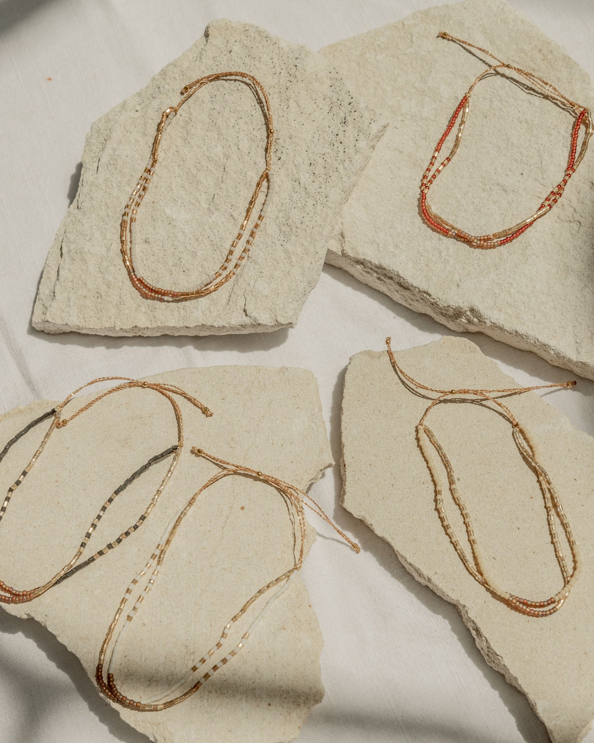 Golden Beaded Bracelet handmade by Village Thrive using natural materials.