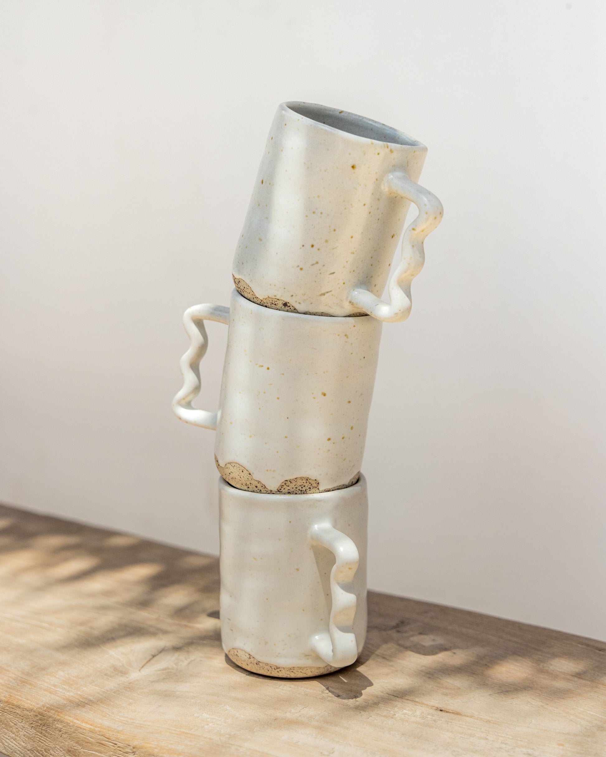 Wabi Ceramic Wavy Mug handmade by Village Thrive using natural materials.