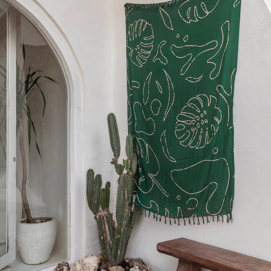 Monstera Tapestry handmade by Village Thrive using natural materials.
