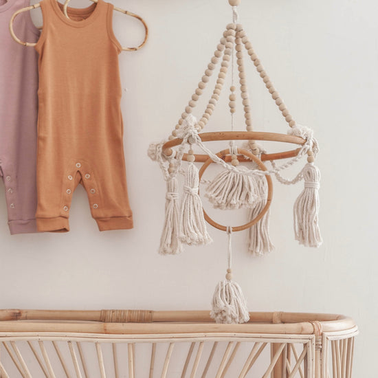 Beaded Baby Mobile handmade by Village Thrive using natural materials.