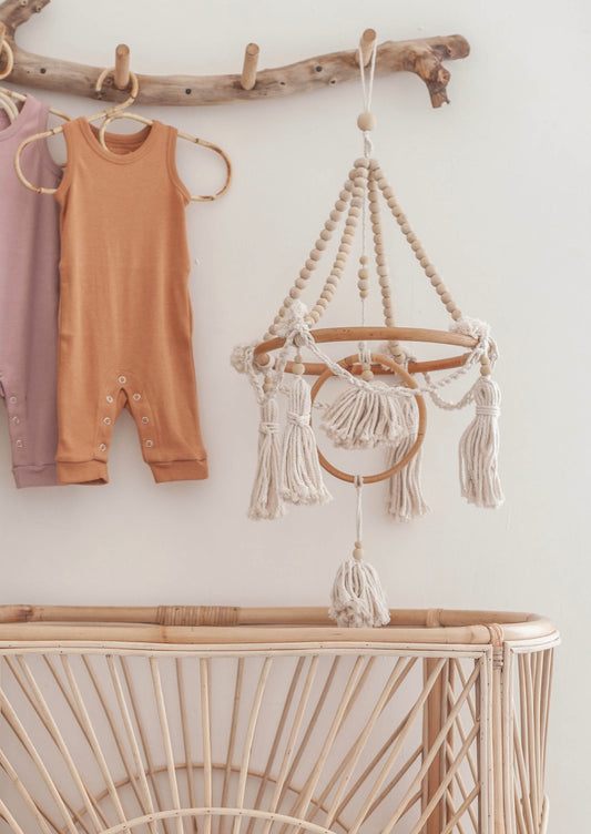 Beaded Baby Mobile handmade by Village Thrive using natural materials.