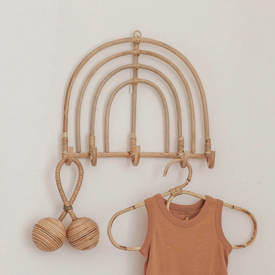 Imperfect Rainbow Rattan Wall Hook handmade by Village Thrive using natural materials.