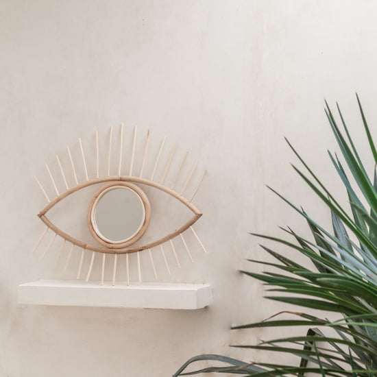 Opened Eye Rattan Mirror handmade by Village Thrive using natural materials.