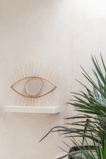 Opened Eye Rattan Mirror handmade by Village Thrive using natural materials.