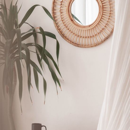 Imperfect Rattan Mirrors handmade by Village Thrive using natural materials.